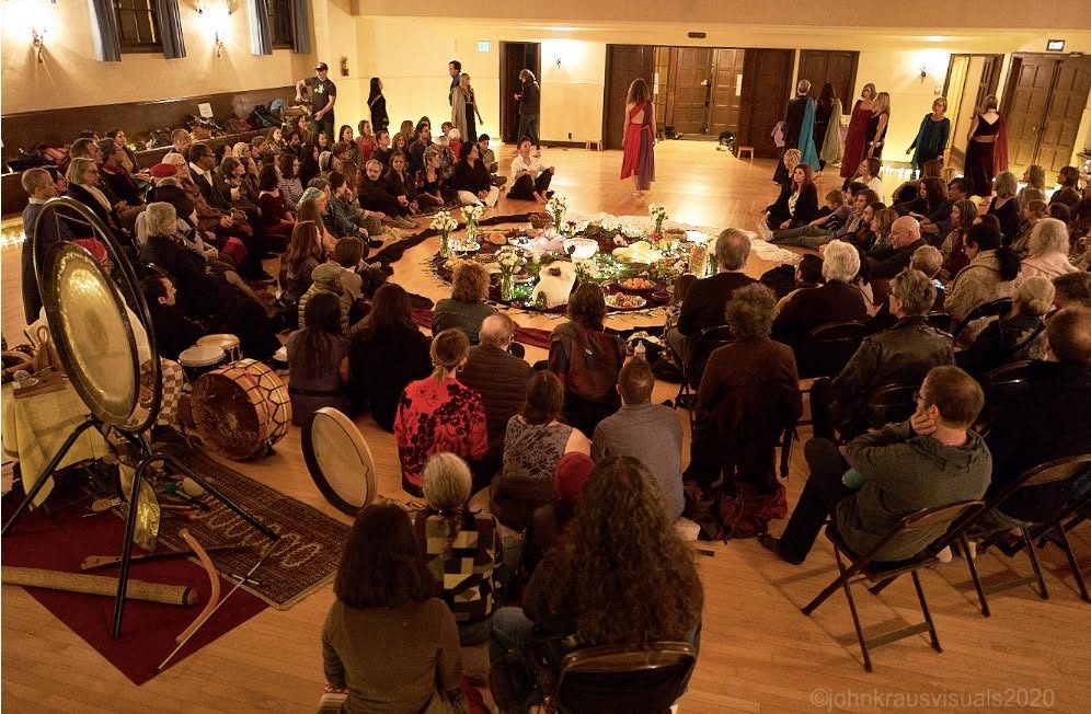 Dancers moving inside the circle, gong and drums at the edge