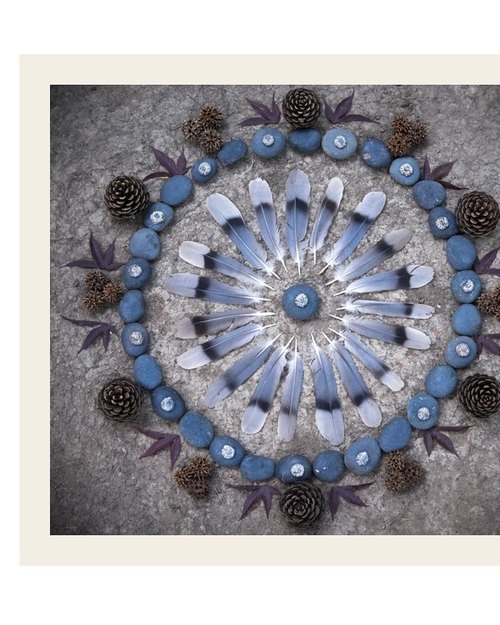 Soul Story Council — a mandala of feathers and stones