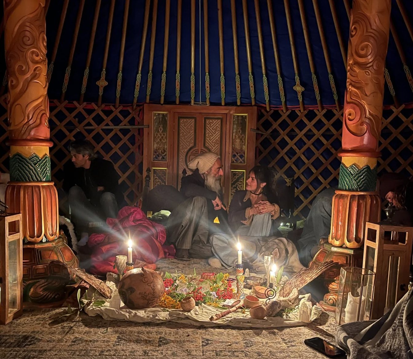 A candlelit ceremony inside a yurt