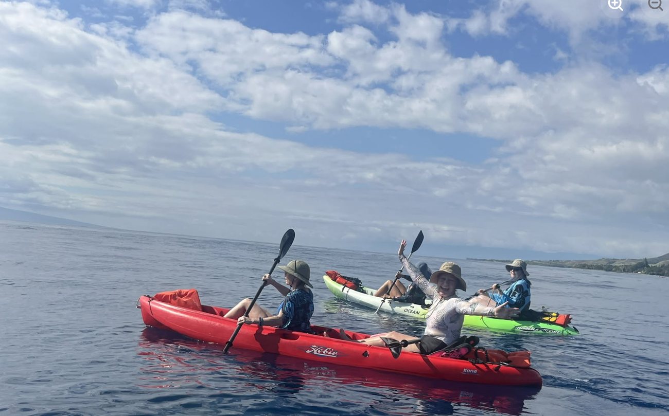 Paddling out together on the ocean