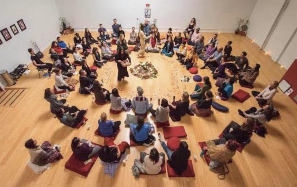 A full circle of people, seen from above